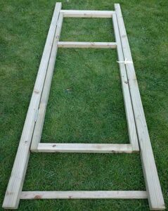 Frame and door assembled for polytunnel installation.